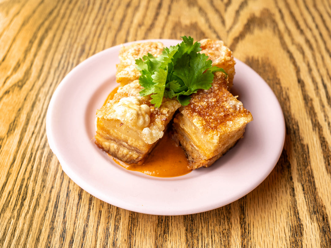 Chicharrón — crispy pork belly with habanero aioli and cilantro at La Ñapa