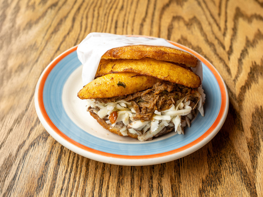 Pabellón arepa — sweet plantains, carne mechada, black beans and cheese at La Ñapa